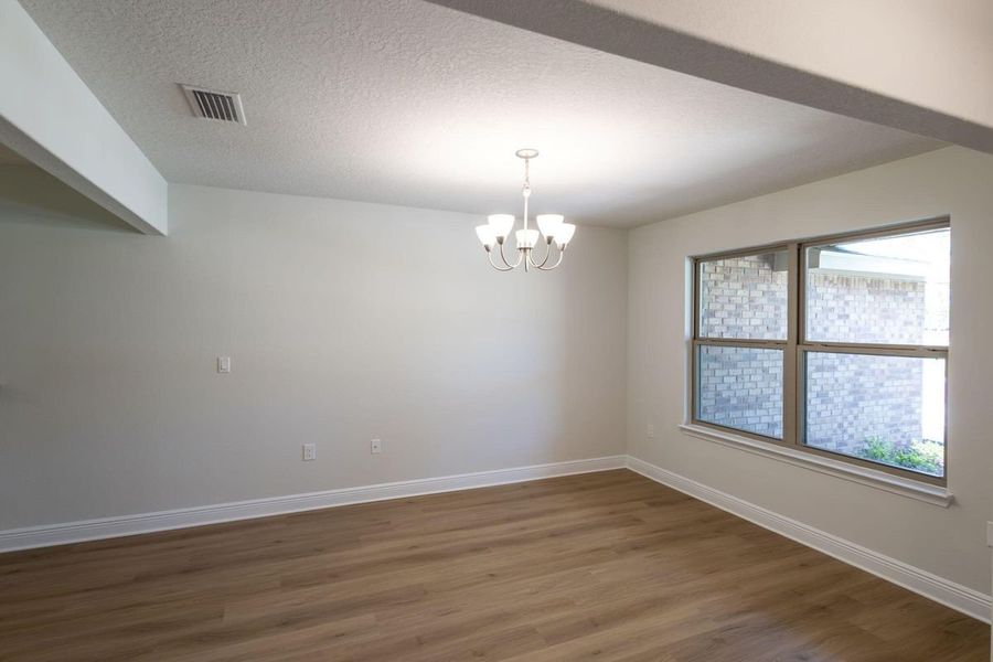 Representative unfurnished interior of a home built from the 2005 by Adams Homes in Parkland Place, Pace (Image 10).