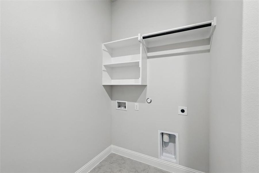 Washroom featuring hookup for an electric dryer, washer hookup, hookup for a gas dryer, baseboards, and light marble finish flooring Washroom featuring hookup for an electric dryer, washer hookup, hookup for a gas dryer, baseboards, and light marble finish flooring