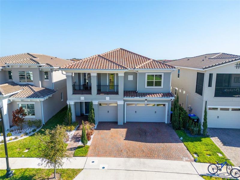 Front exterior of a new home in , Orlando, FL, highlighting curb appeal (Image 22).