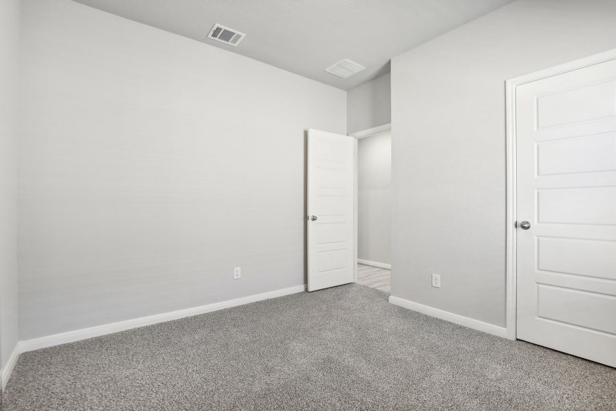 Guest bedroom in the Oleander floorplan at a Meritage Homes community. Guest bedroom in the Oleander floorplan at a Meritage Homes community.