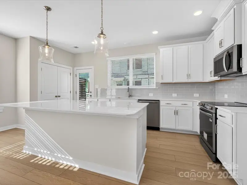 Furnished interior view inside a new home in Central Living at Craig, Charlotte (Image 7).