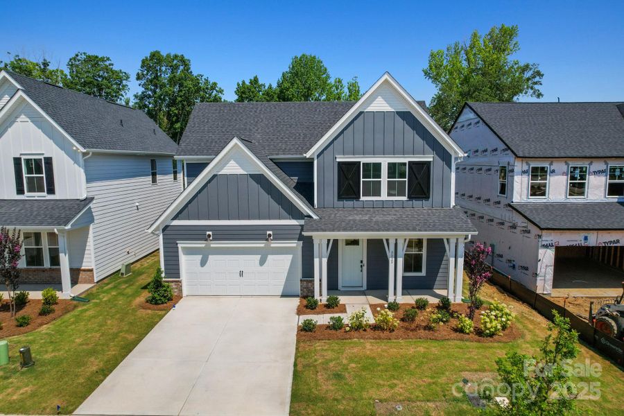 Front exterior of a new home in Cannon Run, Concord, NC, highlighting curb appeal (Image 1). Front exterior of a new home in Cannon Run, Concord, NC, highlighting curb appeal (Image 1).