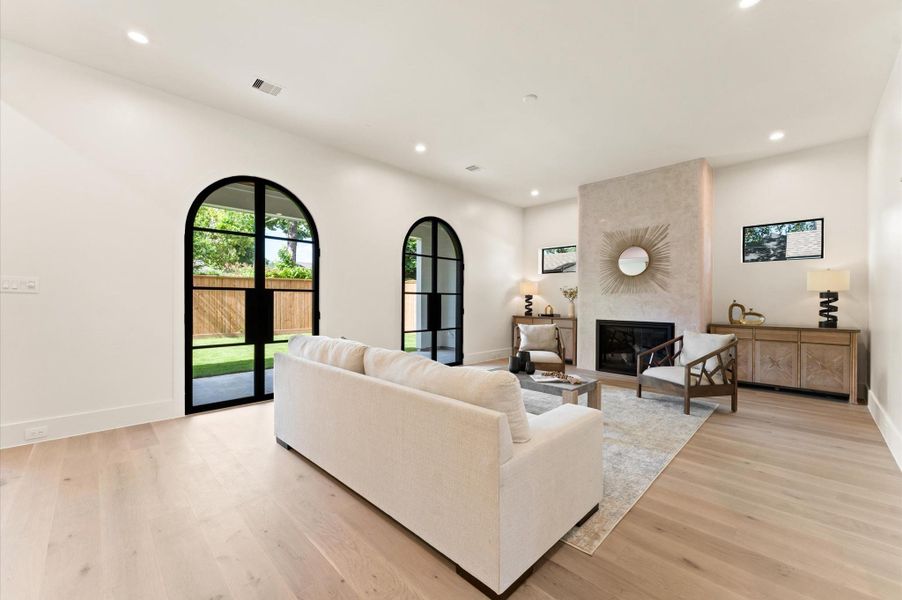 Arched steel French doors in the living room lead to the 9 ft x 25 ft covered patio, ideal for entertaining! Arched steel French doors in the living room lead to the 9 ft x 25 ft covered patio, ideal for entertaining!