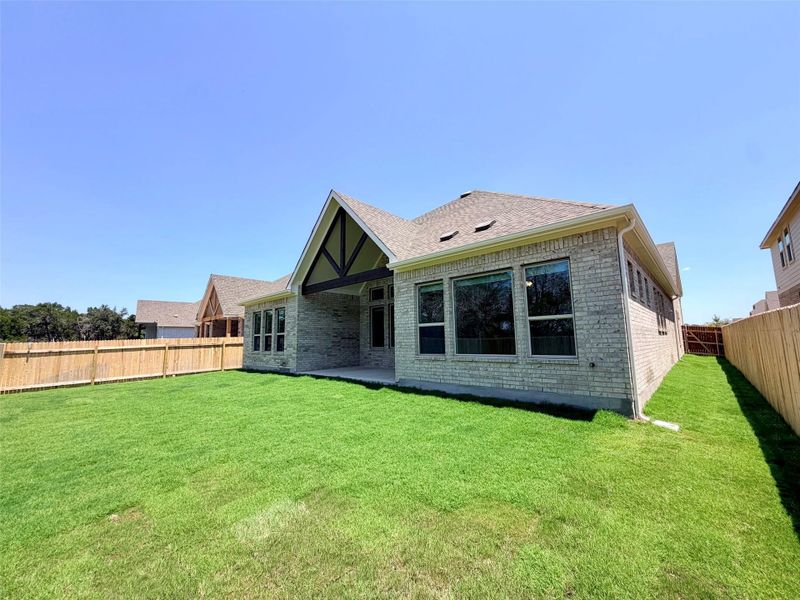 Exterior details and patio area of a home in Retreat at San Gabriel, Georgetown (Image 18).