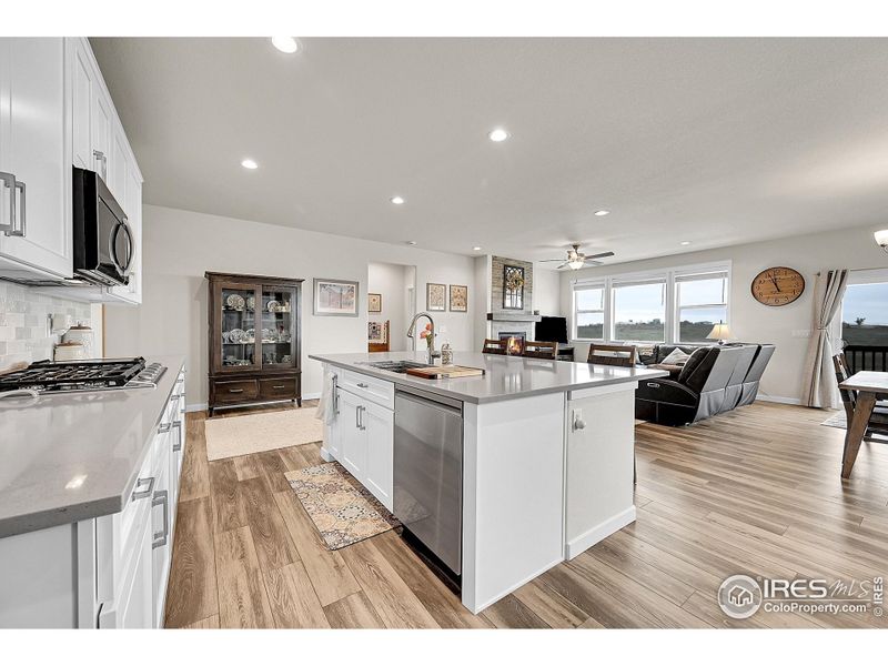 Kitchen and island looking into the living room