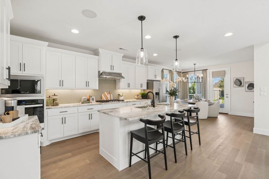 Spacious Kitchen with Island Seating and Dining Space - Representative Photo Plan 1462