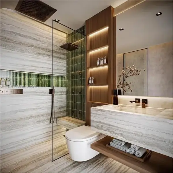 Stone-tiled bathroom featuring a glass-enclosed walk-in shower with integrated wall-mounted shower heads, vertical green tile accents, wood-finish built-in shelving with recessed lighting, and a wall-mounted floating vanity