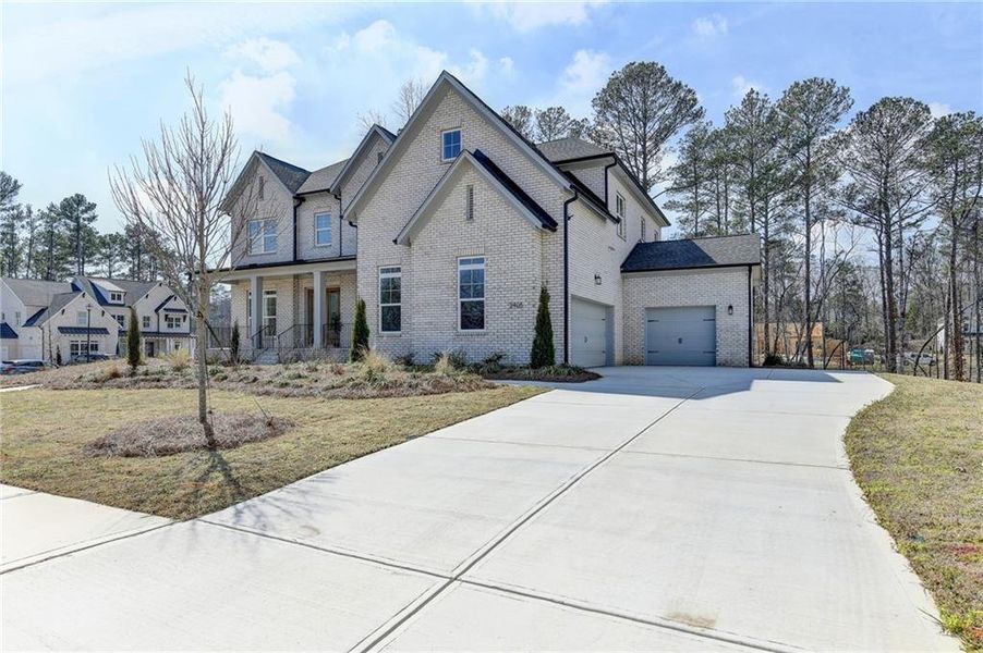 Front exterior of a new home in , Cumming, GA, highlighting curb appeal (Image 24).
