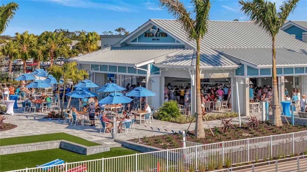 Front exterior of a new home in , Englewood, FL, highlighting curb appeal (Image 26). Front exterior of a new home in , Englewood, FL, highlighting curb appeal (Image 26).