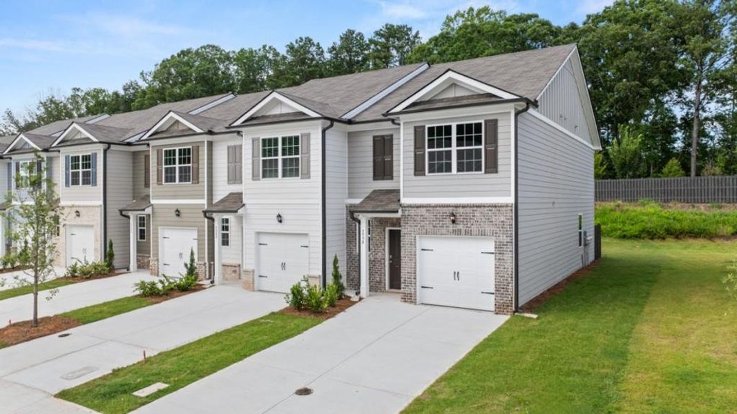 Front exterior of a new home in Woodbury Park, South Fulton, GA, highlighting curb appeal (Image 2).