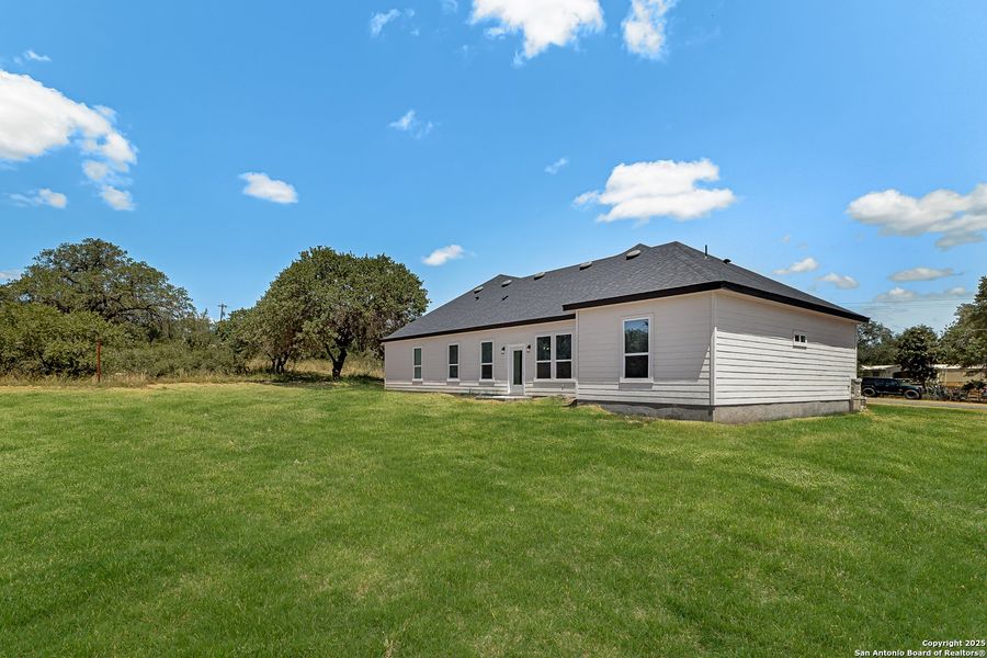 Front exterior of a new home in , Lytle, TX, highlighting curb appeal (Image 22). Front exterior of a new home in , Lytle, TX, highlighting curb appeal (Image 22).
