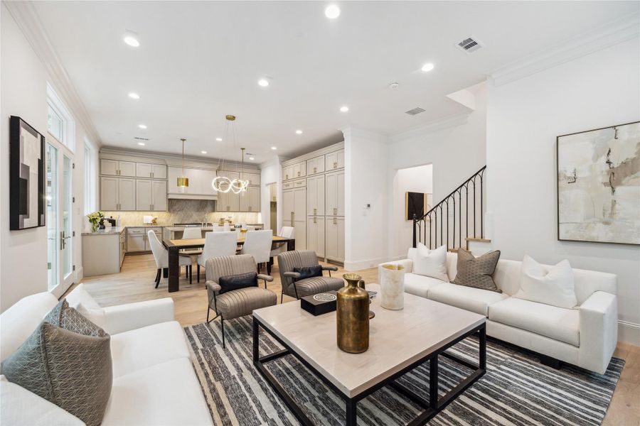 The stunning first floor was designed with relaxation and entertaining in mind! Spacious enough for ample seating surrounding the fireplace, a large dining table, and an island with additional seating that overlooks the living space. The stunning first floor was designed with relaxation and entertaining in mind! Spacious enough for ample seating surrounding the fireplace, a large dining table, and an island with additional seating that overlooks the living space.