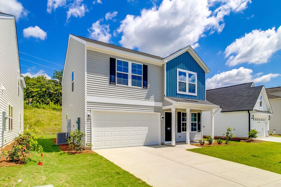 Front exterior of a new home in Bluefield, Lexington, SC, highlighting curb appeal (Image 26). Front exterior of a new home in Bluefield, Lexington, SC, highlighting curb appeal (Image 26).