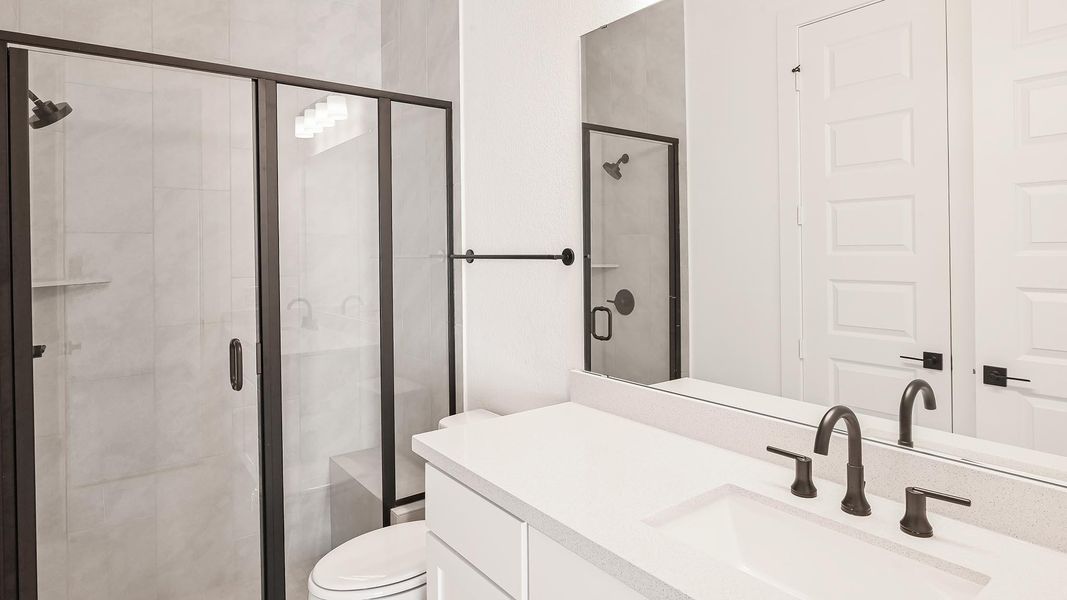 Full bathroom with vanity and a shower stall Full bathroom with vanity and a shower stall