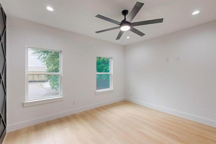 Spare room featuring light wood-style floors, recessed lighting, and ceiling fan Spare room featuring light wood-style floors, recessed lighting, and ceiling fan