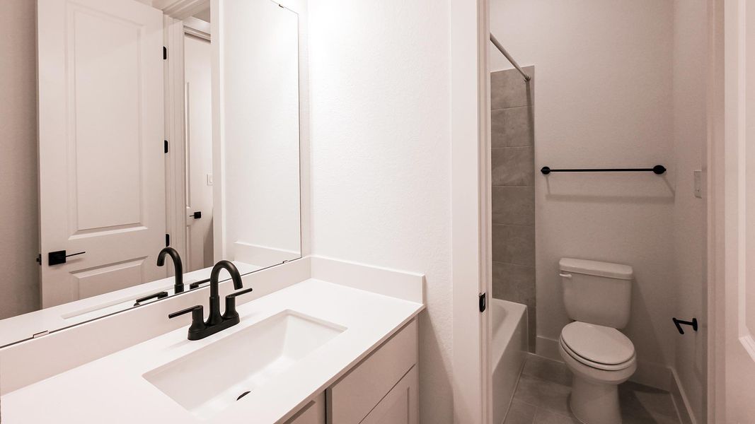 Furnished interior view inside a new home in Crosswinds, Kyle (Image 7).