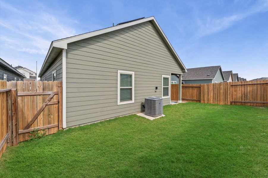 Exterior details and patio area of a home in Cypress Oaks North, Cypress (Image 2).