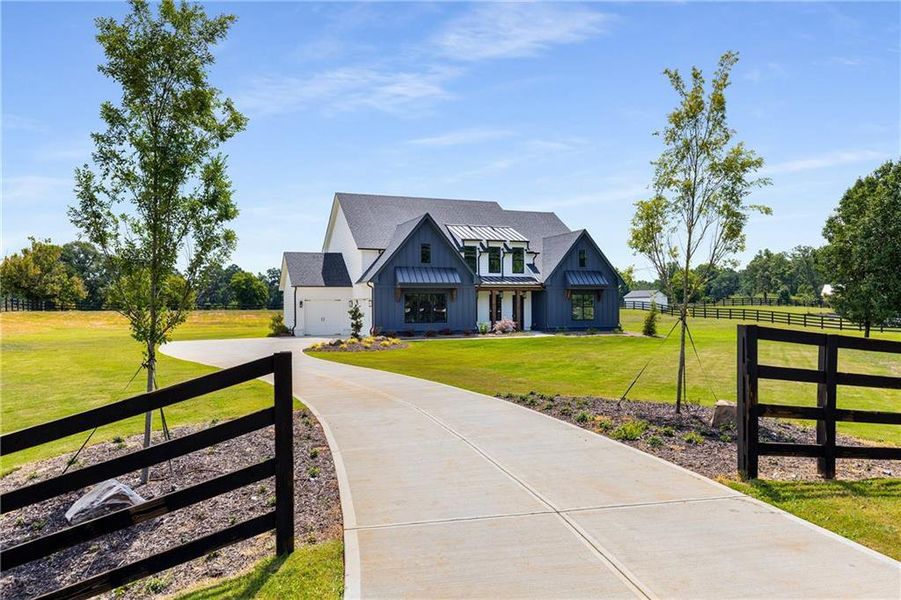 Front exterior of a new home in , Alpharetta, GA, highlighting curb appeal (Image 26). Front exterior of a new home in , Alpharetta, GA, highlighting curb appeal (Image 26).