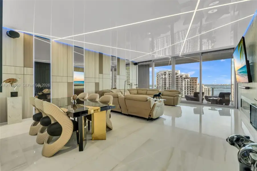 Floor-to-ceiling glass sliding doors, glossy tile flooring, linear LED recessed ceiling lighting, and vertical wood-panel accent walls Floor-to-ceiling glass sliding doors, glossy tile flooring, linear LED recessed ceiling lighting, and vertical wood-panel accent walls