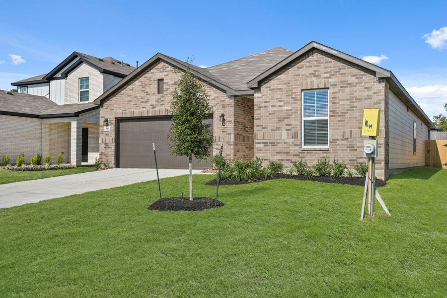 Front exterior of a new home in Lexington Heights, Willis, TX, highlighting curb appeal (Image 1).