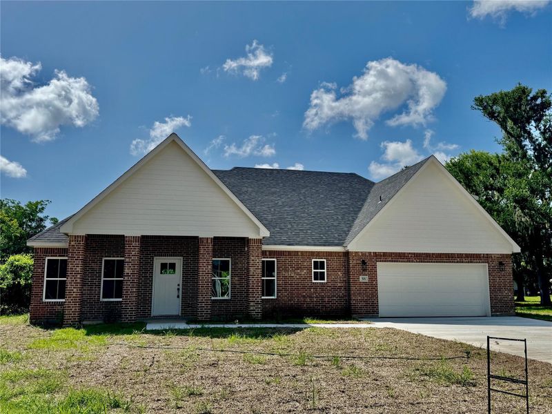 Front exterior of a new home in , Lake Jackson, TX, highlighting curb appeal (Image 1).
