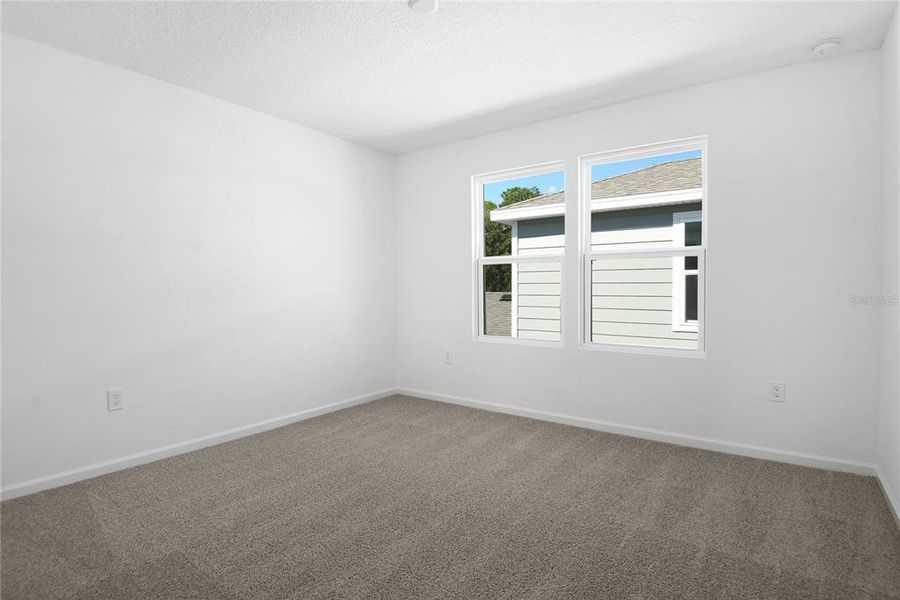 Spacious, unfurnished interior of a new home in Seasons at Shores of Lake Dell, Dundee (Image 12).