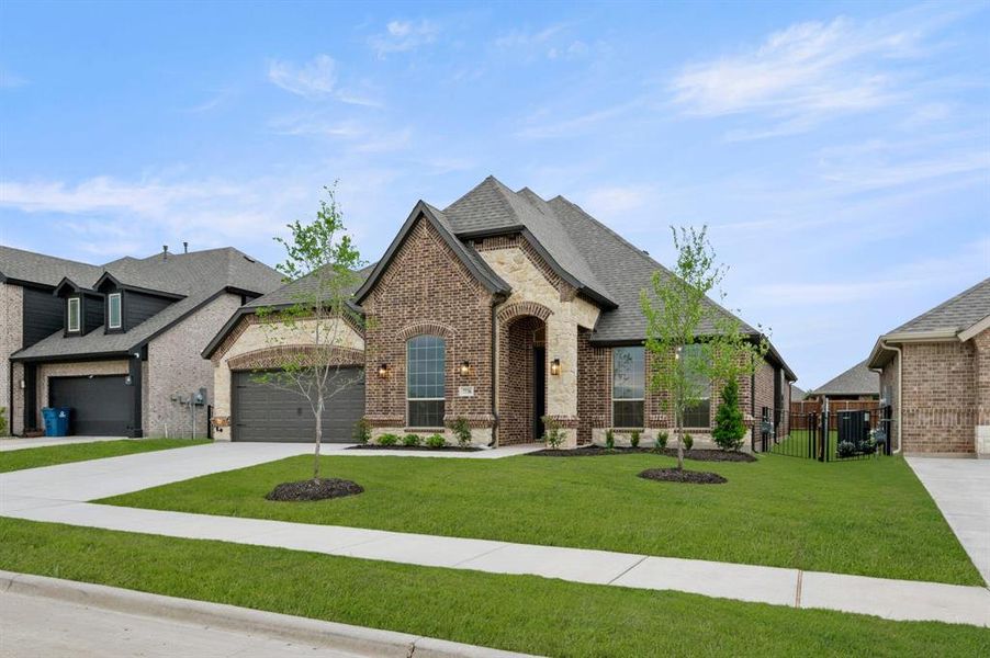 Front exterior of a new home in Silo Mills – Signature Series, Joshua, TX, highlighting curb appeal (Image 18). Front exterior of a new home in Silo Mills – Signature Series, Joshua, TX, highlighting curb appeal (Image 18).