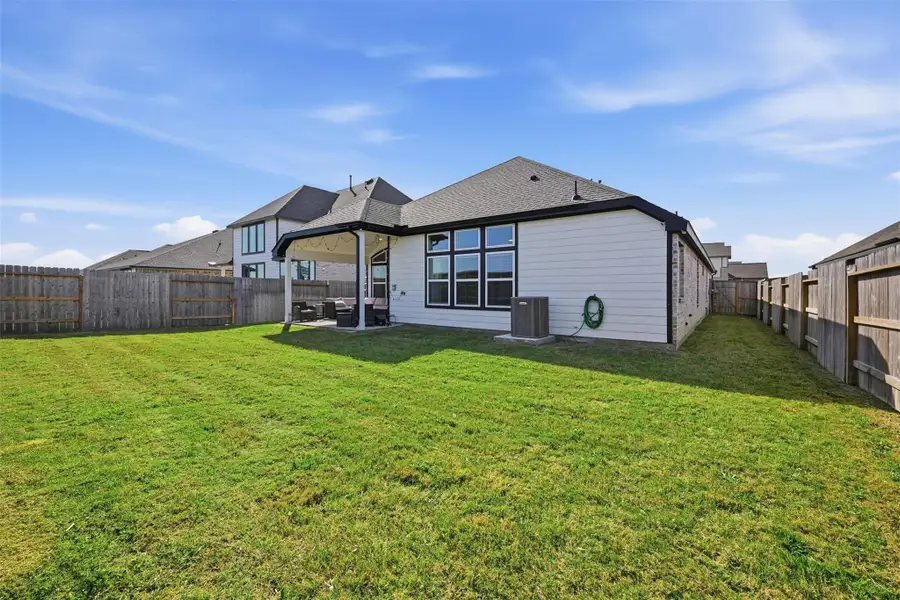 Exterior details and patio area of a home in Oakwood Estates, Waller (Image 4).
