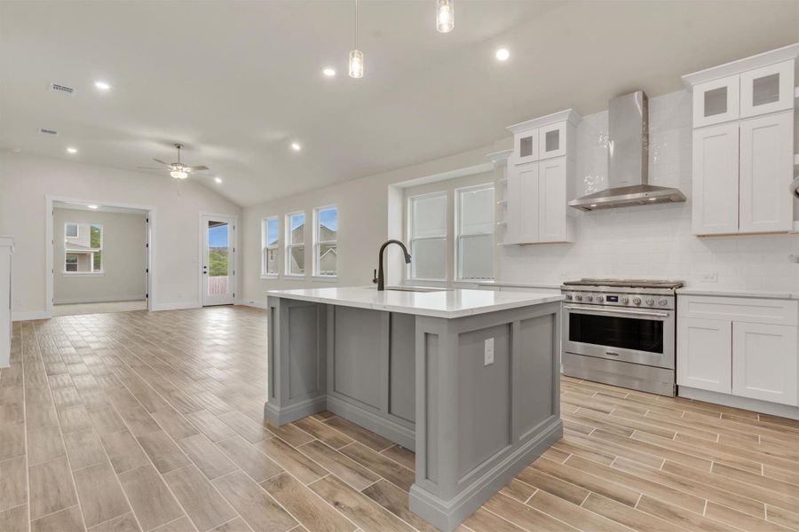 A seamless open-concept design integrates the contemporary kitchen with a sun-filled living area.