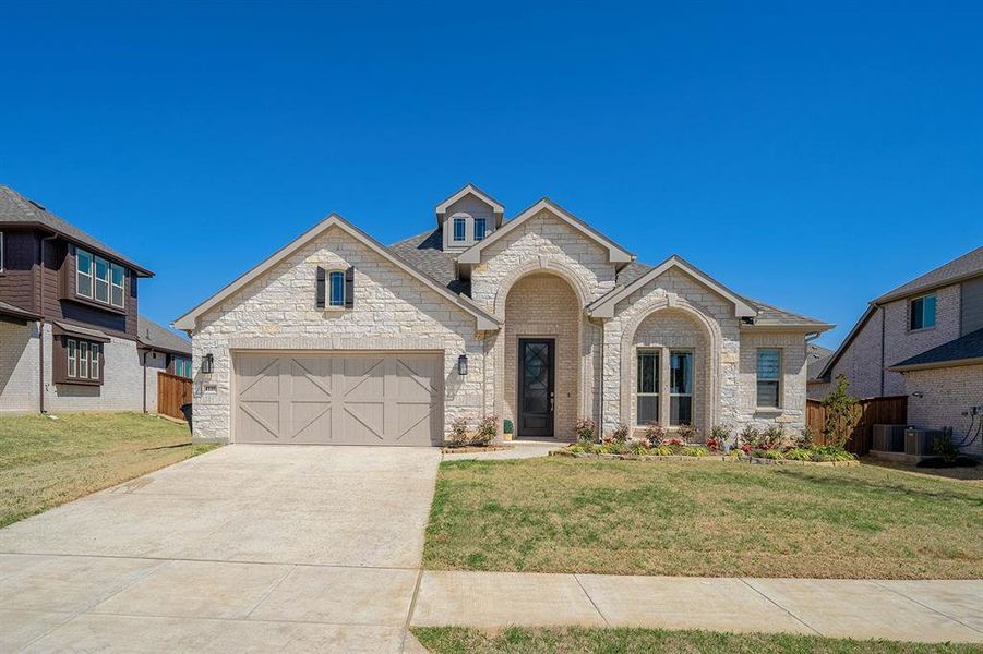 Front exterior of a new home in , Prosper, TX, highlighting curb appeal (Image 22). Front exterior of a new home in , Prosper, TX, highlighting curb appeal (Image 22).