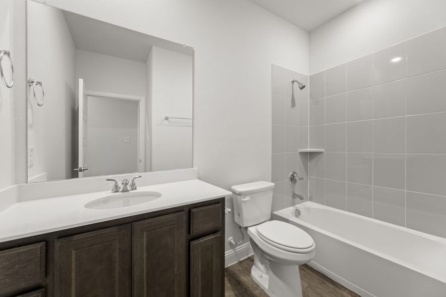 Front exterior of a new home in Redden Farms – Active Adult, Midlothian, TX, highlighting curb appeal (Image 20).