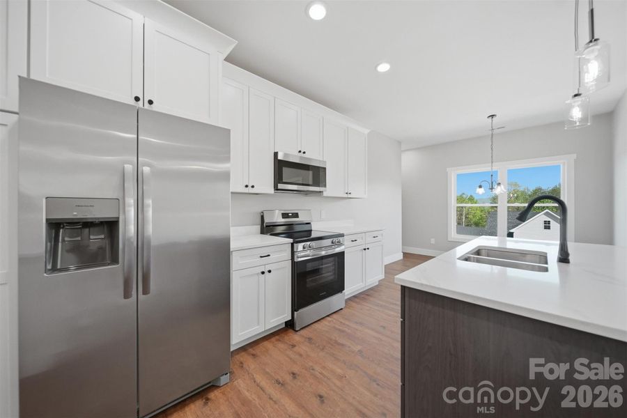 Furnished interior view inside a new home in , Lenoir (Image 12).