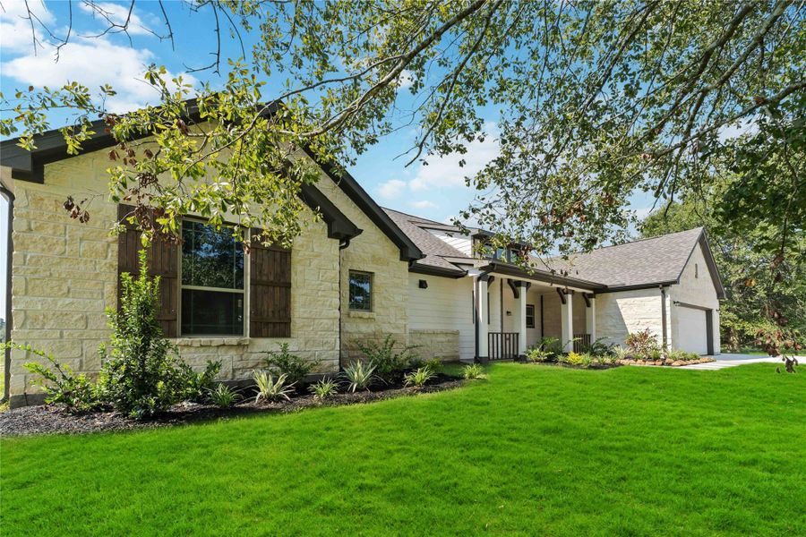 Front exterior of a new home in Barton Place, Cleveland, TX, highlighting curb appeal (Image 2). Front exterior of a new home in Barton Place, Cleveland, TX, highlighting curb appeal (Image 2).