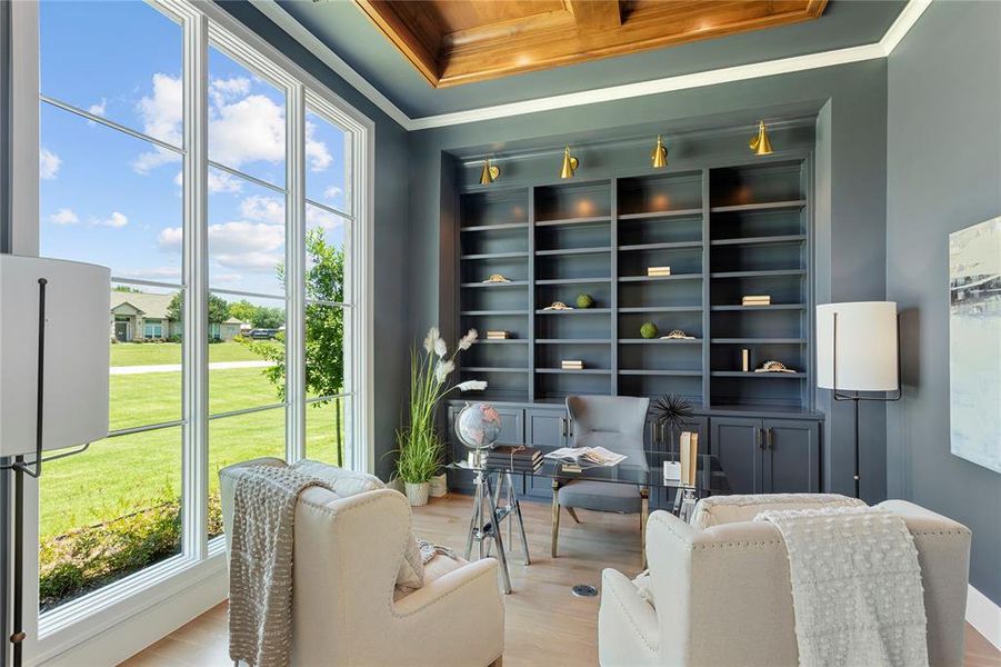 Natural light filled office with custom built-ins.