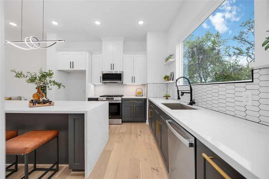 Contemporary, open concept kitchen with high-end finishes