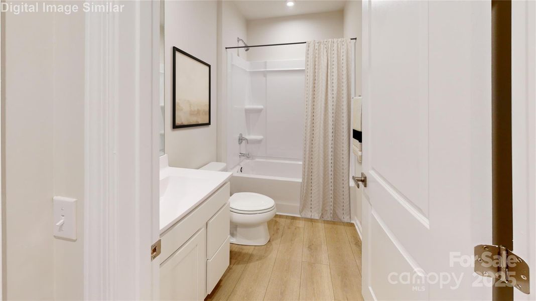 Upstairs bedroom featuring its own bath—offering comfort, convenience, and a touch of luxury for guests or family.