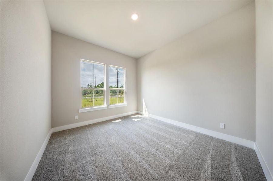 Empty room featuring carpet floors and baseboards Empty room featuring carpet floors and baseboards