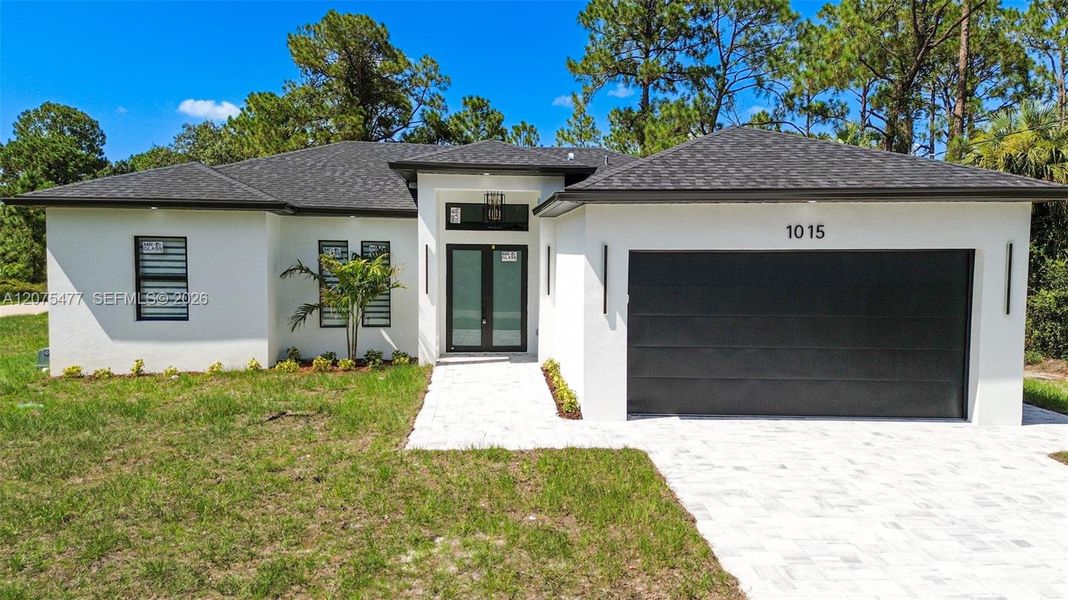 Front exterior of a new home in , Lehigh Acres, FL, highlighting curb appeal (Image 36). Front exterior of a new home in , Lehigh Acres, FL, highlighting curb appeal (Image 36).