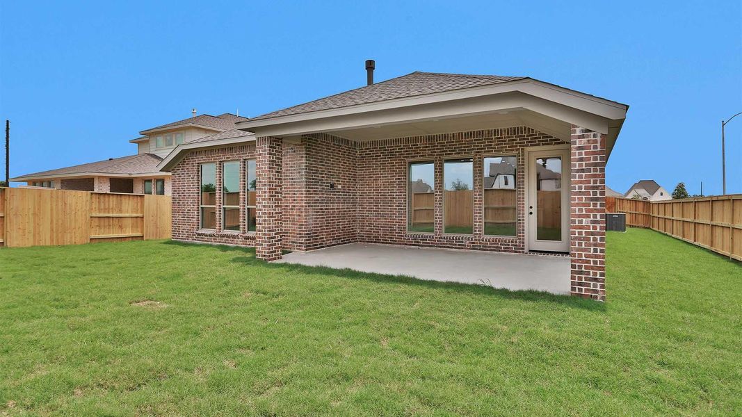 Exterior details and patio area of a home in Meridiana, Manvel (Image 11).