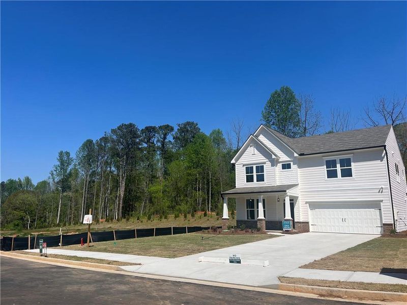 Front exterior of a new home in , Canton, GA, highlighting curb appeal (Image 1). Front exterior of a new home in , Canton, GA, highlighting curb appeal (Image 1).