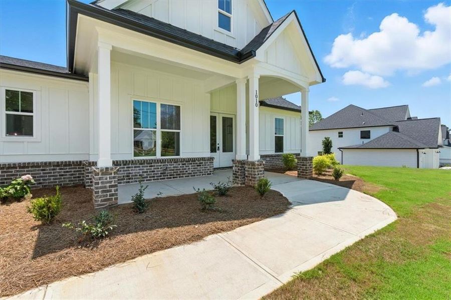 Front exterior of a new home in , Waleska, GA, highlighting curb appeal (Image 21).