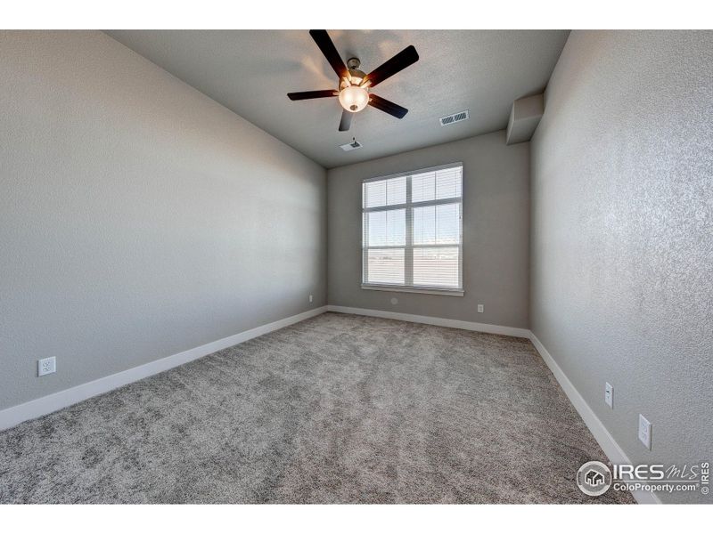 Ceiling fan included in primary bedroom