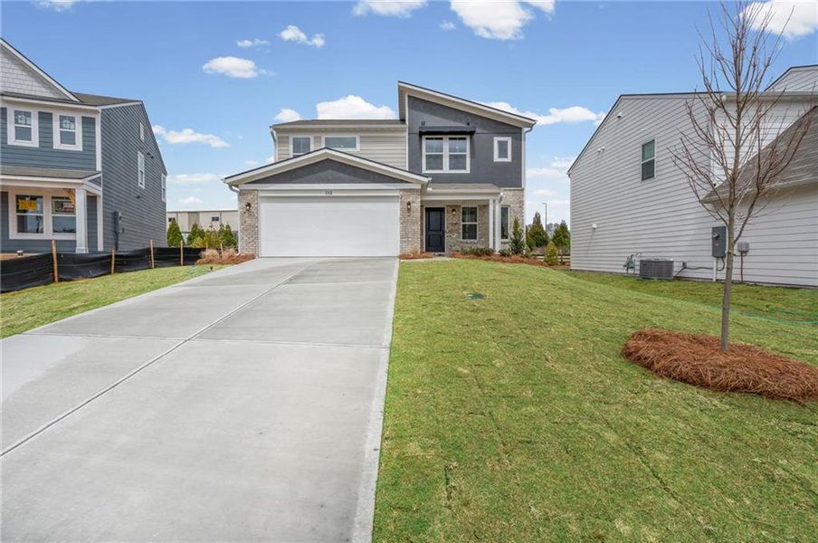 Front exterior of a new home in Crossvine Estates, Braselton, GA, highlighting curb appeal (Image 22).