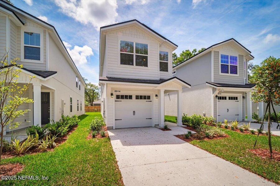 Front exterior of a new home in , Jacksonville, FL, highlighting curb appeal (Image 17).