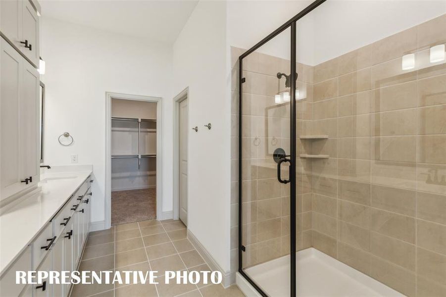 Featuring an oversized walk in shower, this owner's bath is the perfect place to start or end your day!  REPRESENTATIVE PHOTO