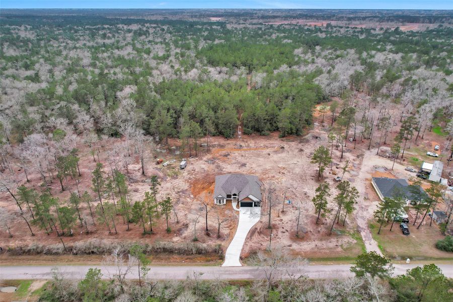 This is an ariel view of the property and surrounding area. This is one of the first homes to be built. The builder is in the planning stages of developing a luxury home on acreage community on the 90 surrounding acres. This is an ariel view of the property and surrounding area. This is one of the first homes to be built. The builder is in the planning stages of developing a luxury home on acreage community on the 90 surrounding acres.