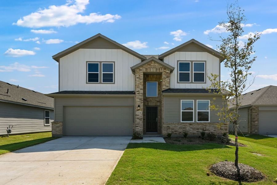 Front exterior of a new home in River Ridge, Crandall, TX, highlighting curb appeal (Image 1). Front exterior of a new home in River Ridge, Crandall, TX, highlighting curb appeal (Image 1).