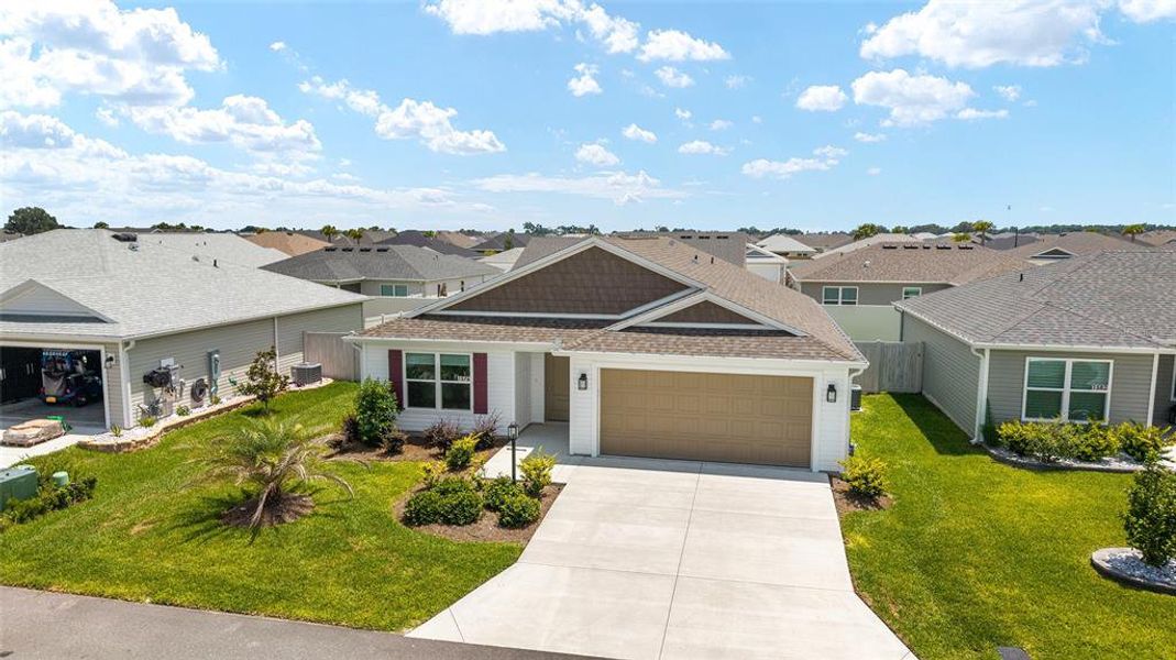 Front exterior of a new home in , The Villages, FL, highlighting curb appeal (Image 18).