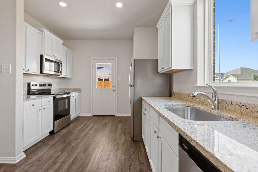 Furnished interior view inside a new home in Vacek Country Meadows, Richmond (Image 1).