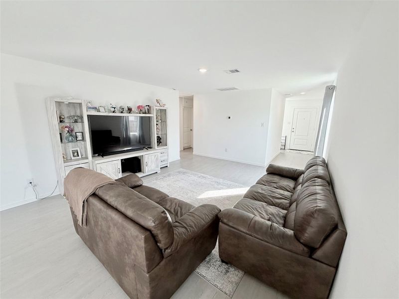 View from dining area towards entrance to the left and the other two secondary bedrooms to the right. View from dining area towards entrance to the left and the other two secondary bedrooms to the right.